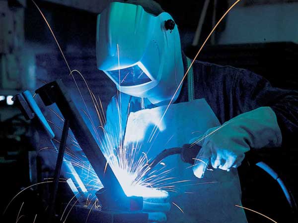 Man welding with MIG welder