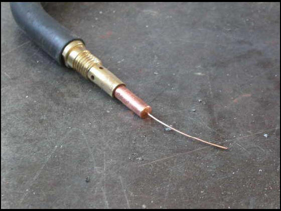 Screw tip on MIG welding torch  